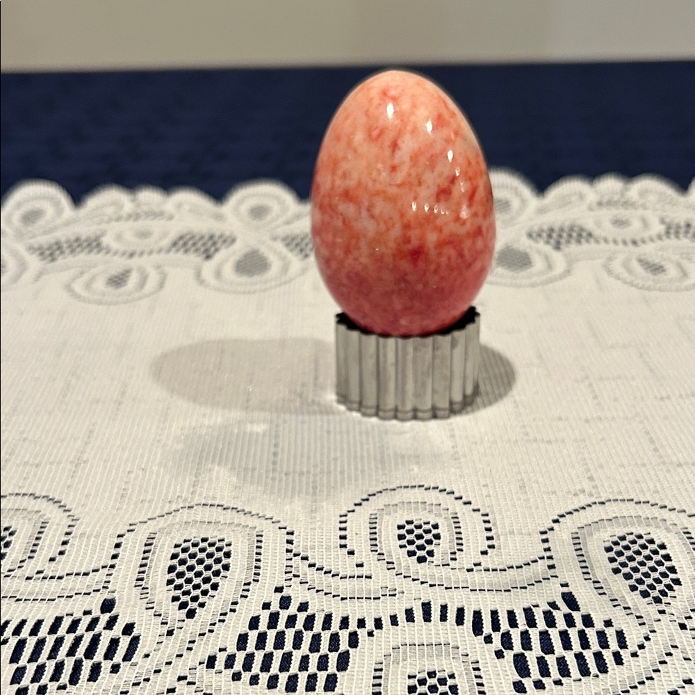 Pink marble egg perfect for Easter or home decor.